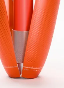 1:1 detail: the knurled sleeve, the dimpled seed field and the engraved ruler ring