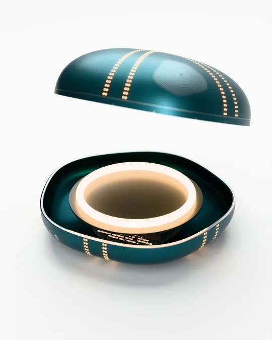 The upper shell lifted to show the LED ring inside